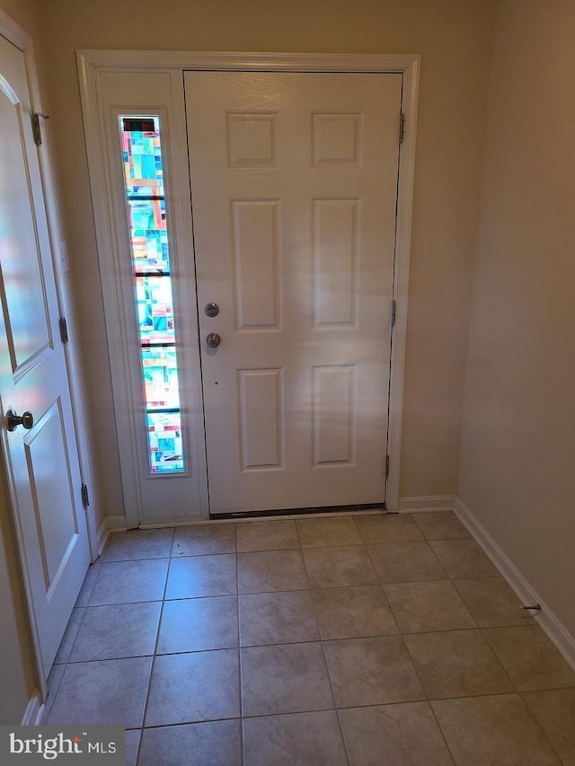 foyer with light tile patterned floors