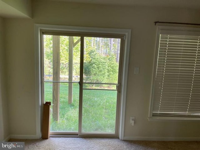 entryway featuring light carpet