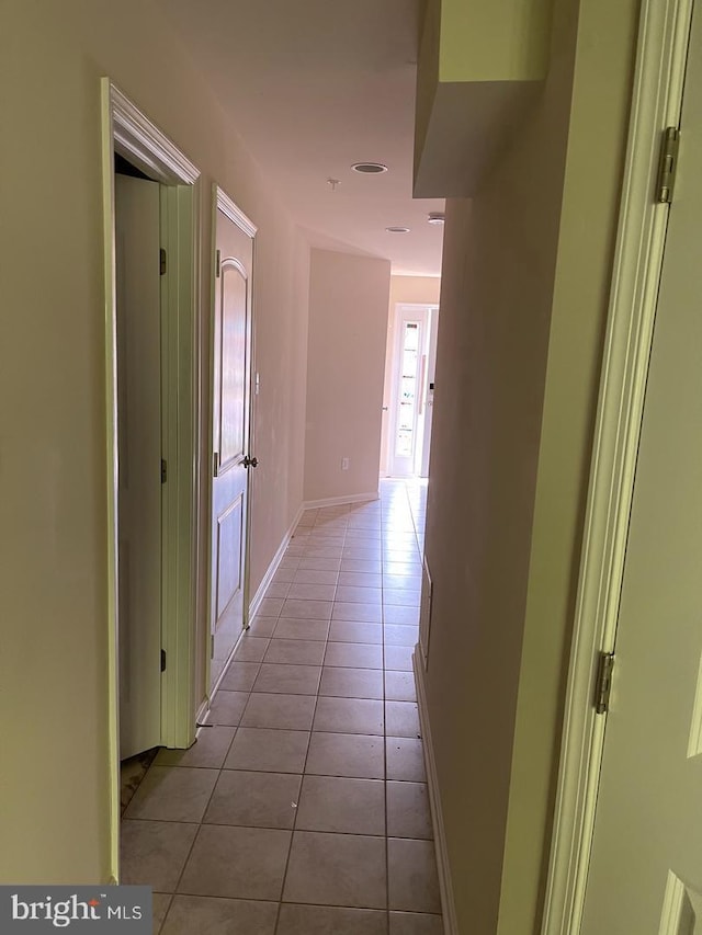 hallway with light tile patterned floors