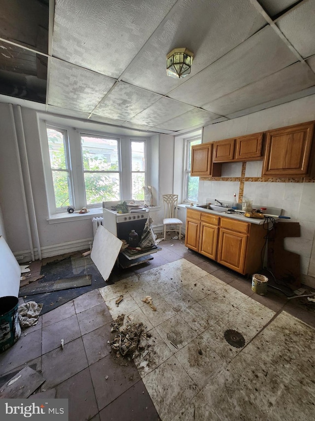 kitchen with plenty of natural light and tile patterned floors