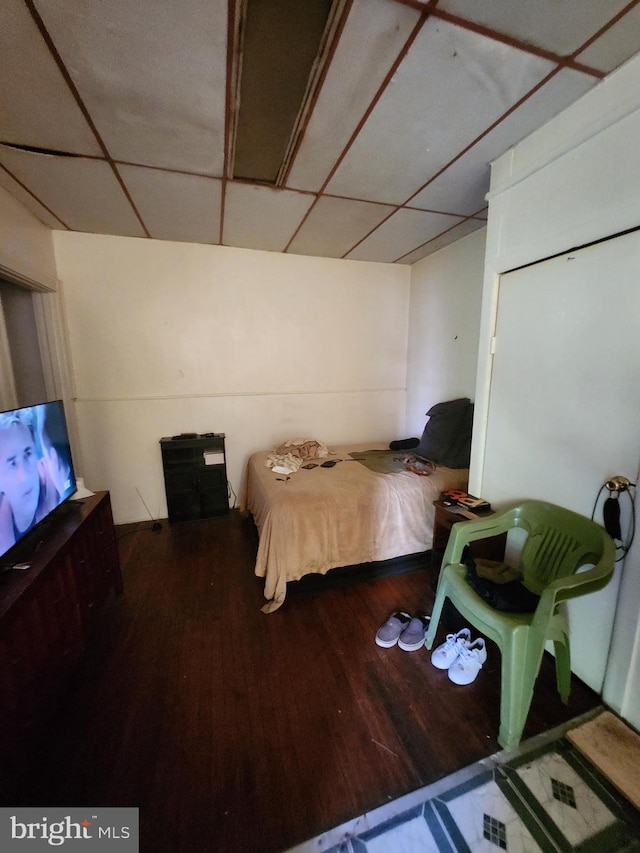 bedroom with wood-type flooring