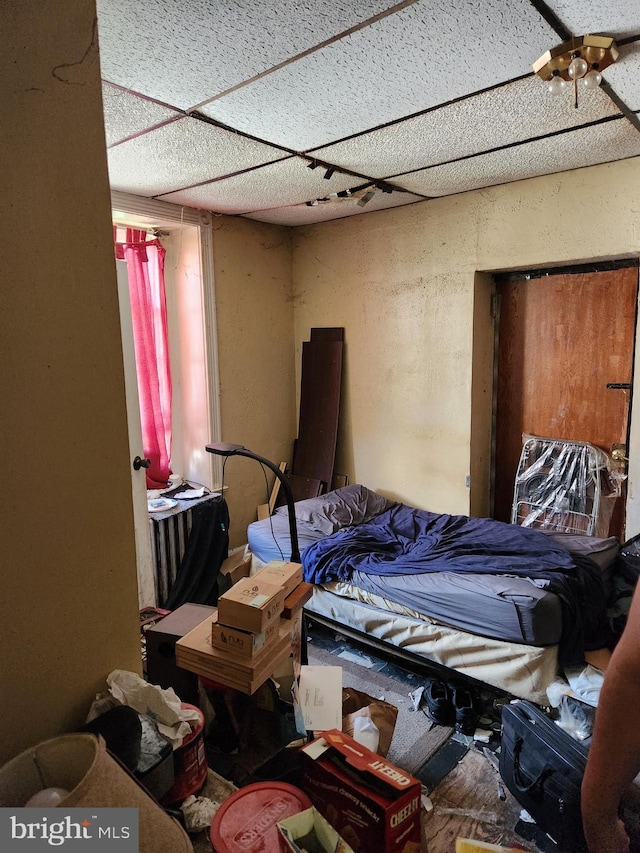 bedroom featuring a paneled ceiling