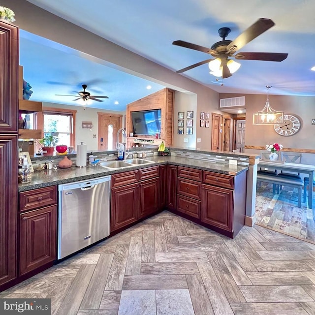 kitchen featuring dishwasher, kitchen peninsula, light parquet floors, pendant lighting, and sink