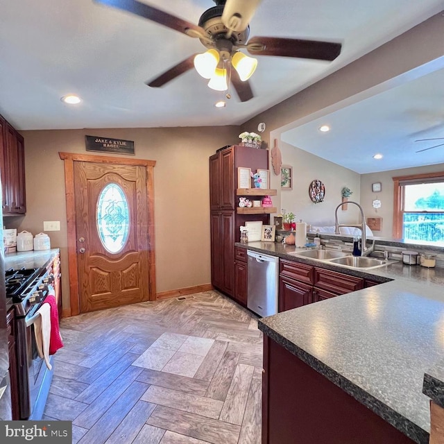 kitchen featuring sink, ceiling fan, light parquet floors, and appliances with stainless steel finishes