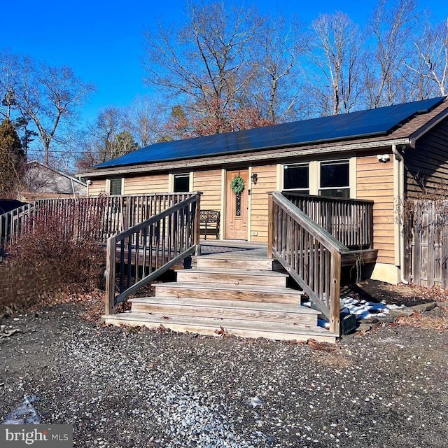 view of front of home featuring solar panels