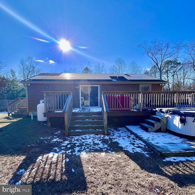 back of property featuring a deck