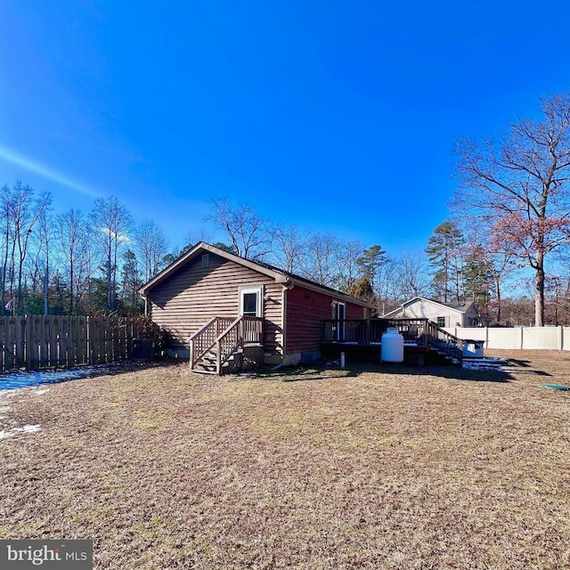 view of property exterior featuring a wooden deck