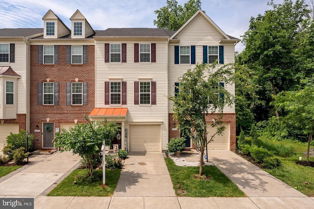 townhome / multi-family property featuring a garage