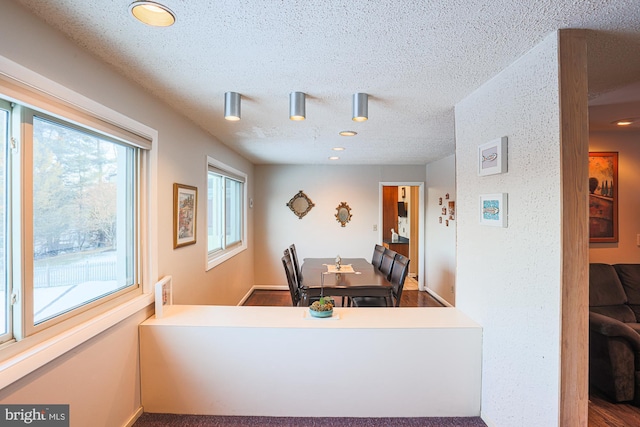 interior space featuring a textured ceiling