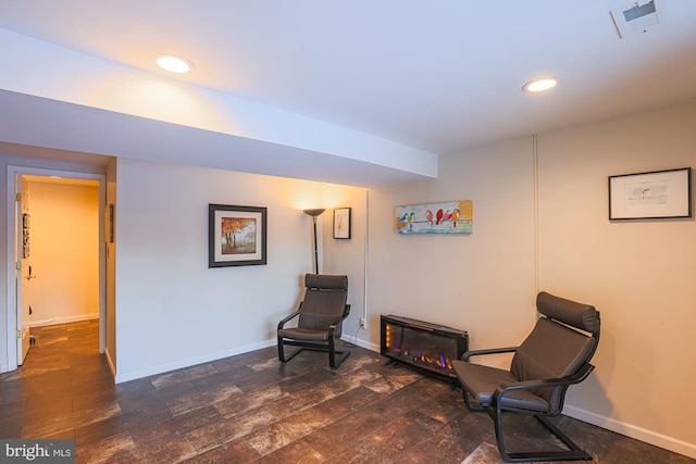 sitting room with dark hardwood / wood-style floors