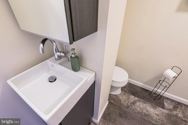 bathroom with sink and toilet