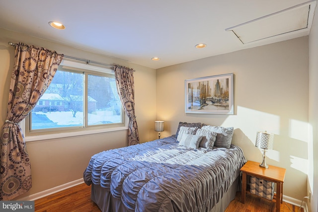 bedroom with dark wood-type flooring