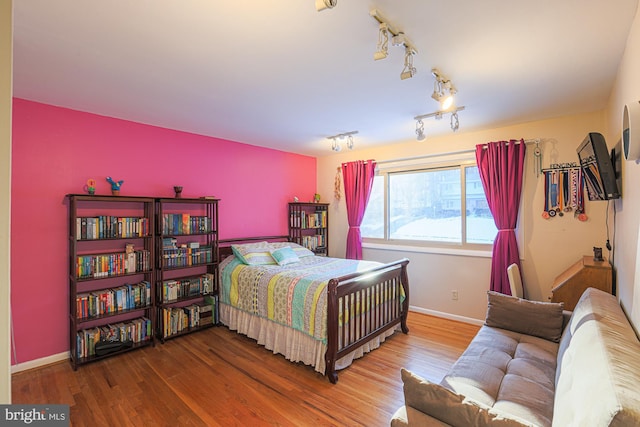 bedroom featuring wood-type flooring