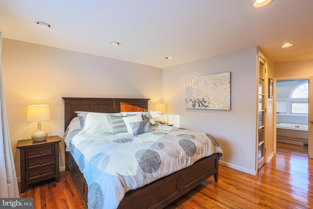 bedroom with dark wood-type flooring