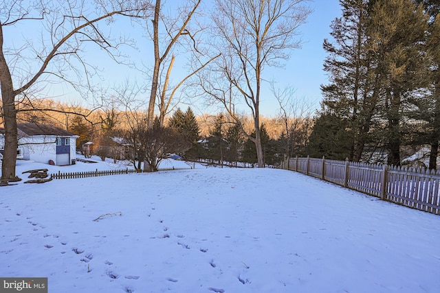 view of yard covered in snow