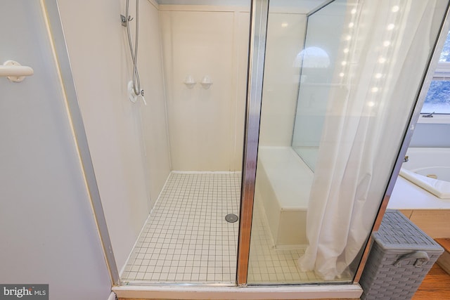 bathroom with shower with separate bathtub