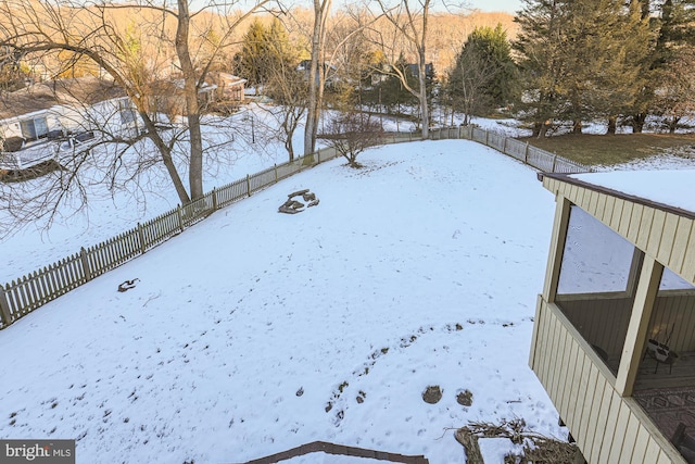 view of yard layered in snow