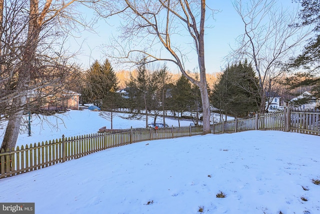 view of yard layered in snow