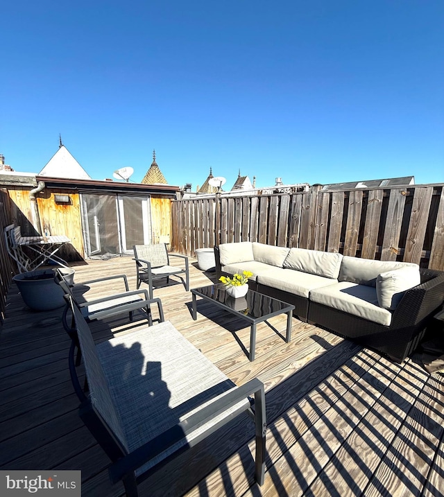 wooden deck with an outdoor hangout area