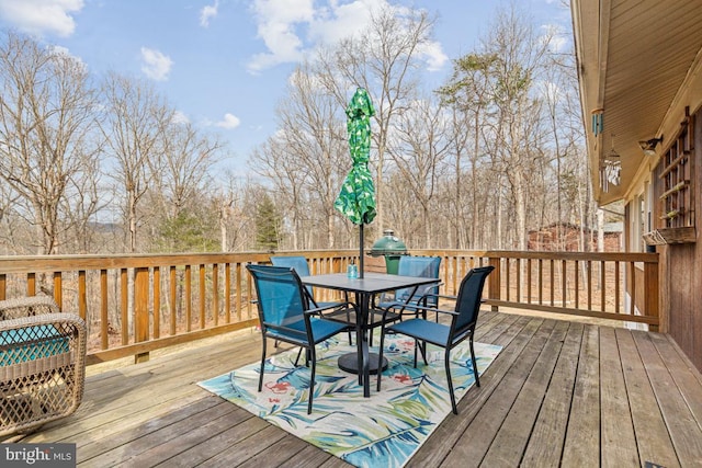 wooden deck with outdoor dining area