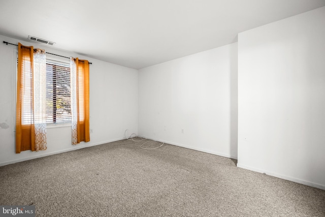 spare room featuring carpet