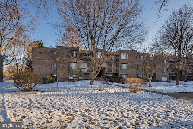 view of snow covered property