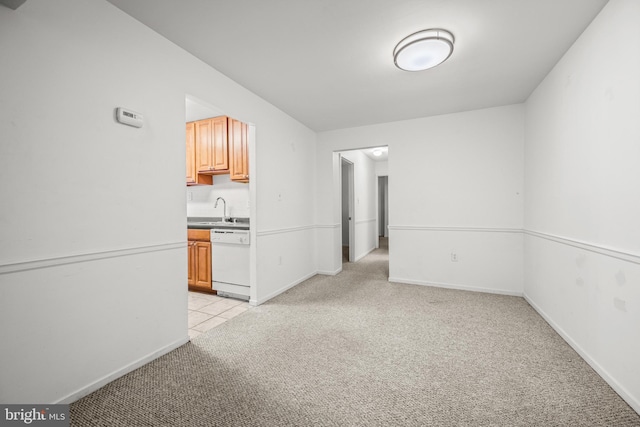 interior space featuring light colored carpet and sink