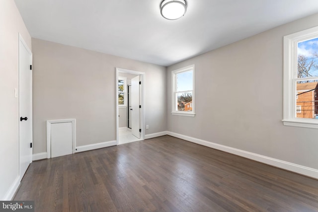 empty room featuring dark hardwood / wood-style floors