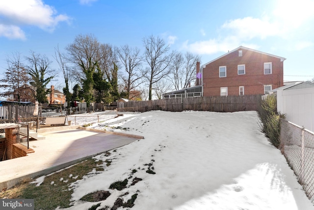 view of yard covered in snow