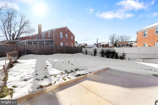 view of yard layered in snow