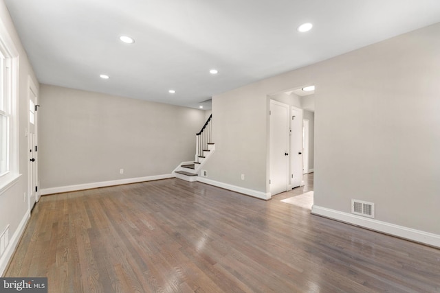 empty room featuring dark hardwood / wood-style flooring