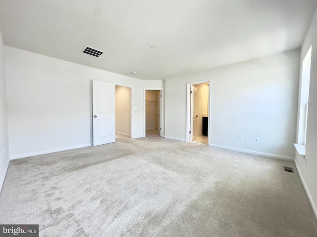 empty room with light colored carpet