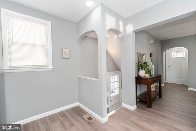 hall with light hardwood / wood-style floors