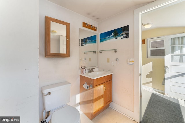 bathroom featuring vanity and toilet