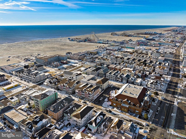 bird's eye view featuring a beach view and a water view