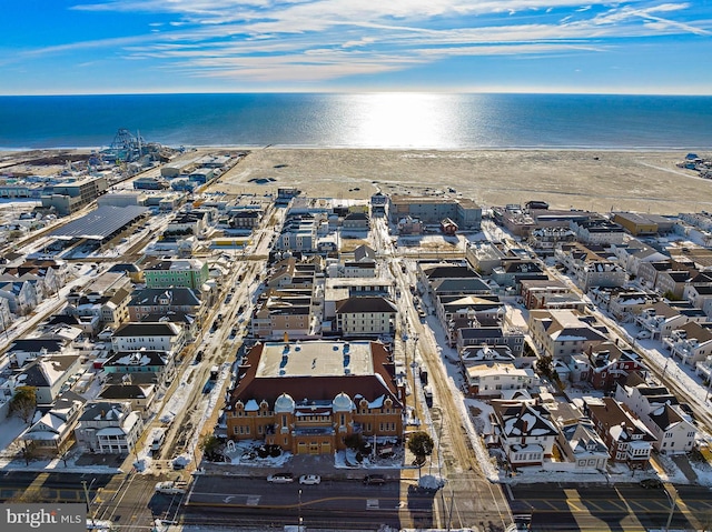 drone / aerial view with a water view and a view of the beach