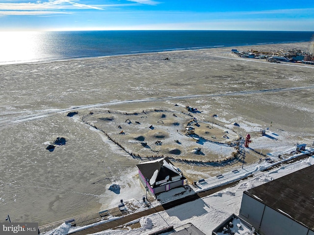 bird's eye view featuring a beach view and a water view