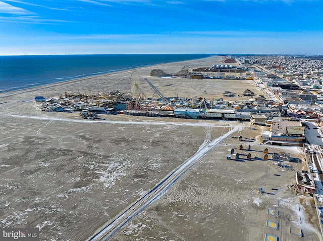 drone / aerial view featuring a view of the beach and a water view