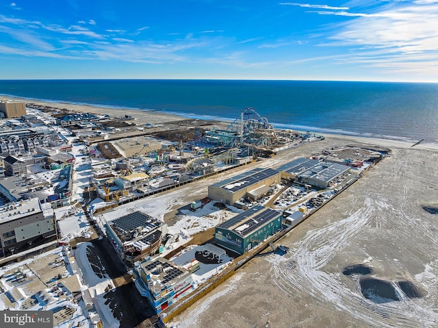 aerial view with a water view and a view of the beach