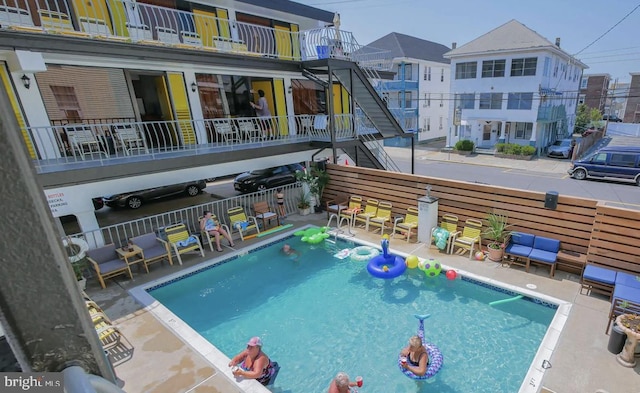 view of swimming pool with a patio