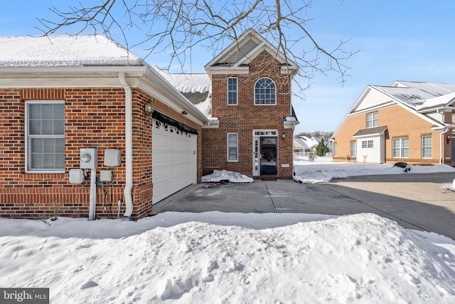 front of property with a garage