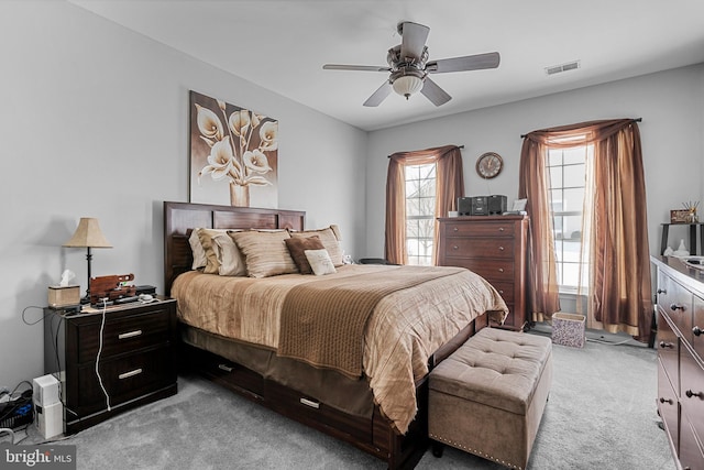 carpeted bedroom with ceiling fan