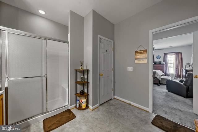 bathroom with ceiling fan and a shower with shower door