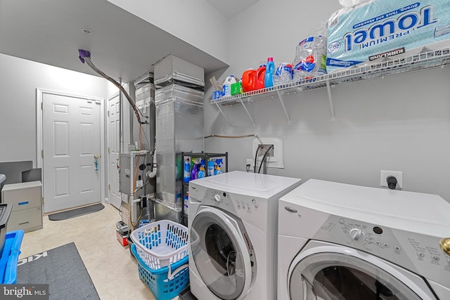 washroom with independent washer and dryer