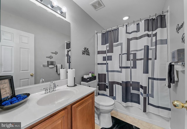 full bathroom with toilet, shower / bath combo with shower curtain, tile patterned floors, and vanity