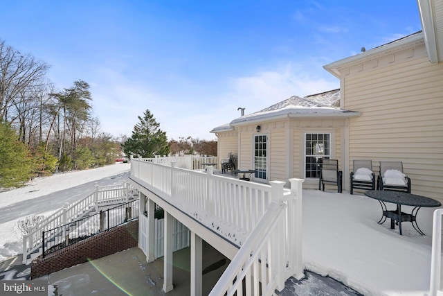 view of snow covered deck