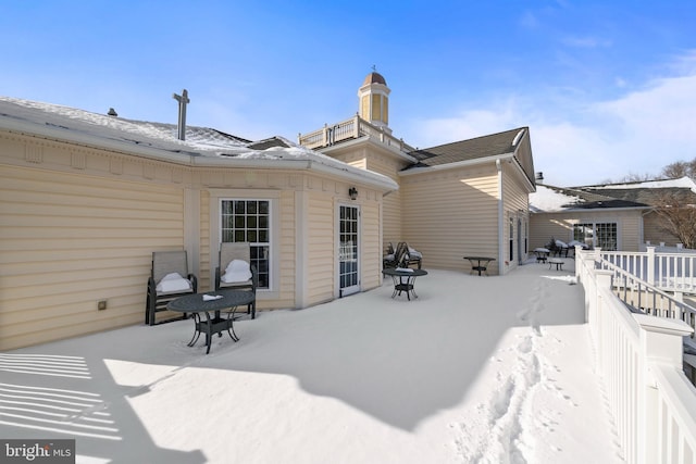 view of snow covered house