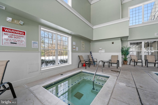 view of swimming pool with an indoor in ground hot tub