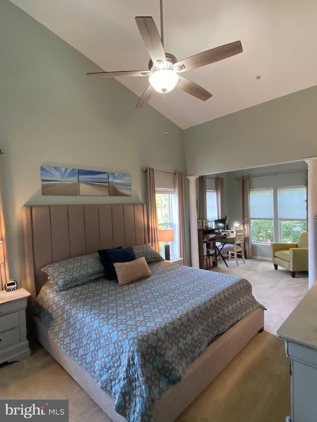 bedroom featuring ceiling fan, light colored carpet, and lofted ceiling