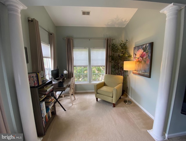 office area with light carpet, ornate columns, and lofted ceiling